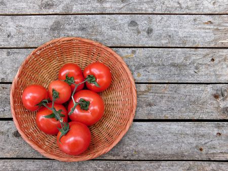 Tomatoes on wooden backgroundの写真素材