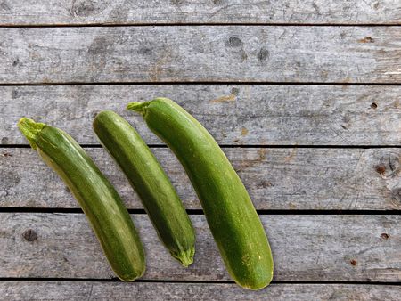 Zucchini on wooden backgroundの写真素材