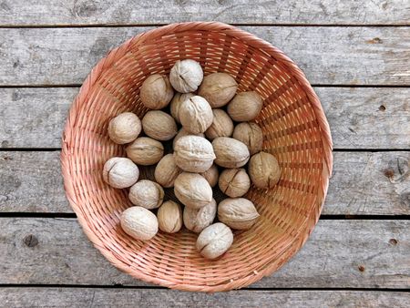 Nuts with shell on wooden backgroundの写真素材