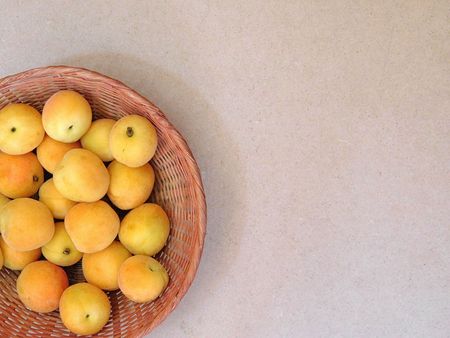 Apricots on wooden backgroundの写真素材