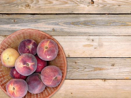 Peaches on wooden backgroundの写真素材