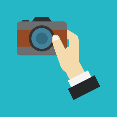 Hand holding a camera. Vector illustration in flat style. Isolated on blue background.