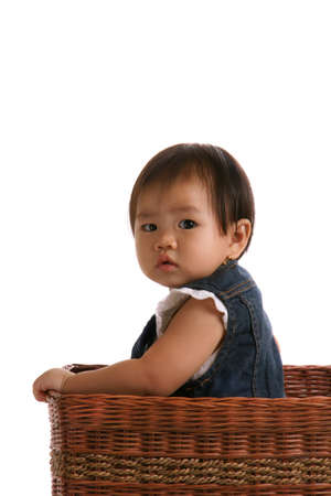 Cute girl in the basketの写真素材