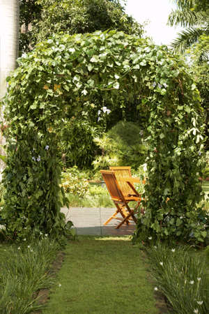 Entrance gate with wooden chairの写真素材