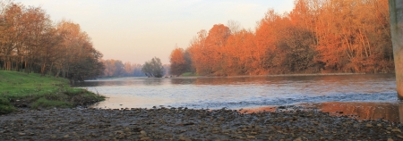 landscape in Italy with the sunset on the river
