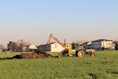 rural scene, old tractor at workの写真素材