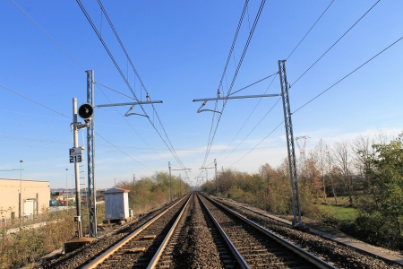 Two sets of railroad tracks run straight and parallelの写真素材