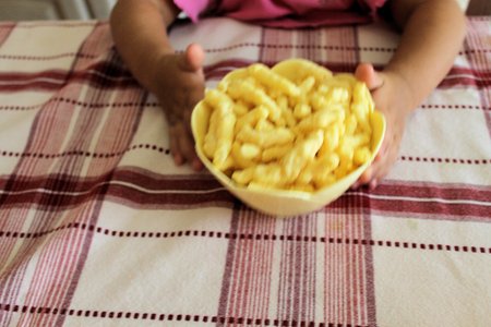small hands take a bowl of chips