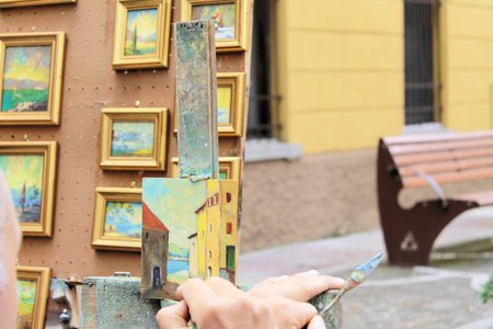 artist paints oil painting on canvasのeditorial素材