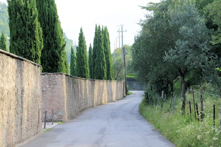 road between ancient walls in Italyの写真素材