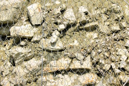 stones imprisoned by wire meshの写真素材