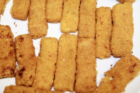 sticks of breaded fishの写真素材