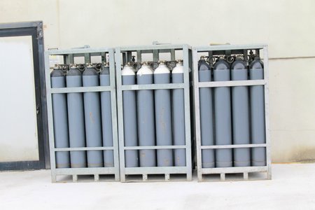 Cylinder of oxygen and nitrogen outside of a factoryの写真素材