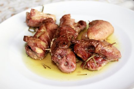 roast meat with rosemary and sage  in the plateの写真素材