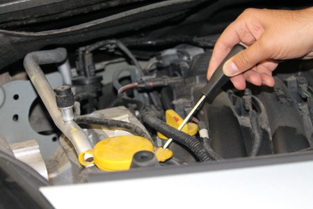 Car mechanic repairs a motor vehicleの写真素材