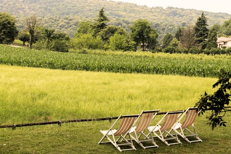 deckchair with rural views in Italyの写真素材