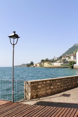 wooden walkway in Gargnano on Garda  lake in northern Italyの写真素材