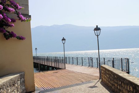 wooden walkway in Gargnano on Garda  lake in northern Italyの写真素材