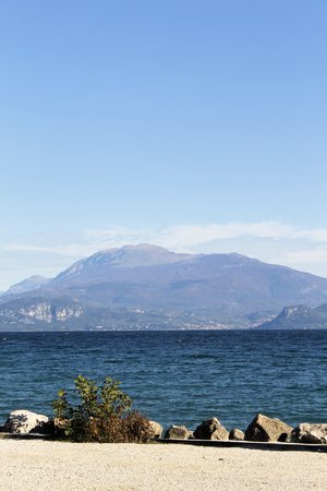 landscape of the beach in Sirmione on Garda lake in northern Italyの写真素材