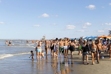 People strolling on the beach of Gatteo a mare in Romagna in Italy on Adriadico seaのeditorial素材