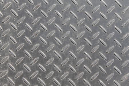 a metal background or texture with tread plate patternの写真素材