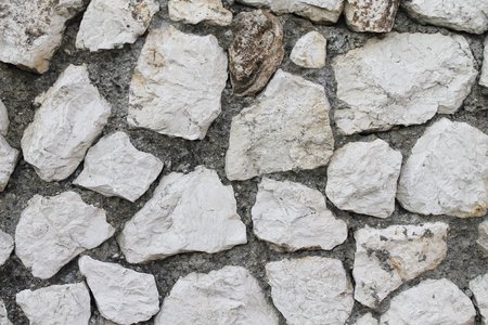 ancient rustic gray and old stone wall textureの写真素材