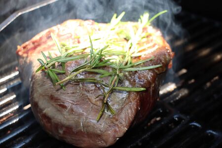 Steak of beef with rosemary cook on the grillの写真素材