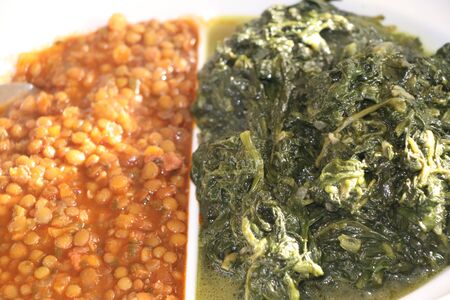 vegetarian dish with cooked lentils and spinachの写真素材