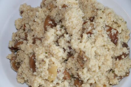 Dish with mushroom and couscous in a plateの写真素材