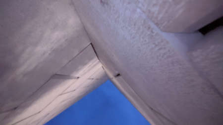 architectural detail of skyscraper, bottom up view with sky