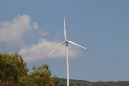 An image of windturbine generator on a sunny day.
