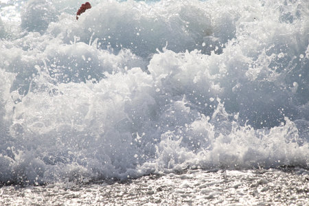 Waves breaking on the shore of the Mediterranean Sea in Turkey.