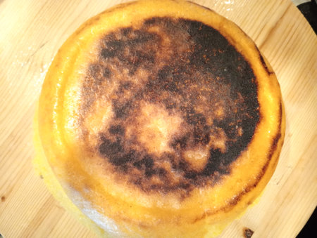 Close up of a crepe de nata on a wooden board