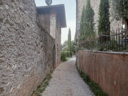 A narrow street in the medieval village of San Gimignano, Tuscany, Italyの写真素材