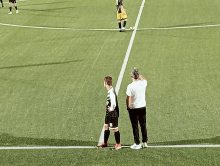 Children play soccer on the field. Kids playing football on the fieldの写真素材