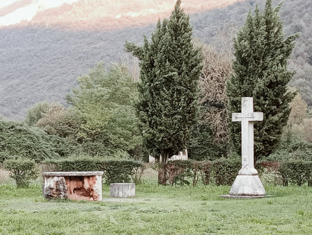 Cross in a cemetery in Italy. Toned image.の写真素材