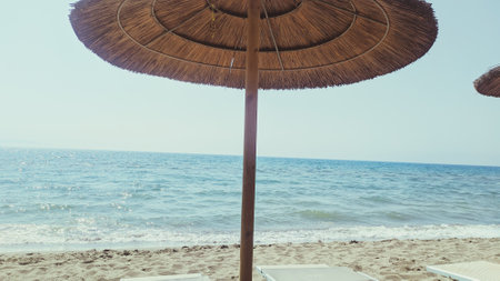 Umbrella and chair on the beach - vintage effect style picturesの写真素材