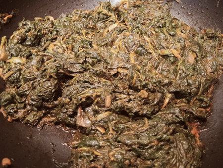 Korean traditional food Spinach and carrot fried in a pan.の写真素材