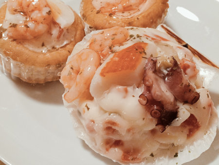 Seafood tartlets on a white plate, close-upの写真素材