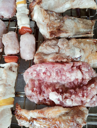 Grilled meat on the grill,Thai street food style.の写真素材