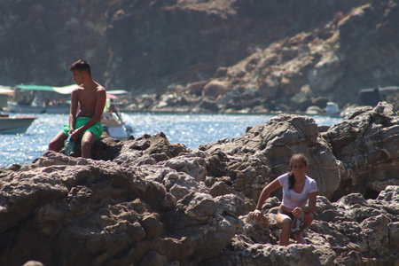 Mother and son playing in the seaの写真素材