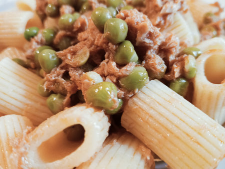 Rigatoni pasta with green peas and meat. Toned.の写真素材