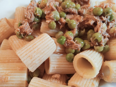 Penne pasta with tuna and green peas, closeup of photoの写真素材