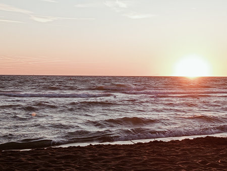 Beautiful sunset over the sea. Color toning effect applied.の写真素材