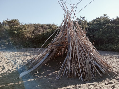 Traditional wigwam on the sandy beach of the dunes.の写真素材