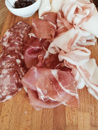 Sliced prosciutto crudo or jamon. Traditional Italian antipasti.の写真素材