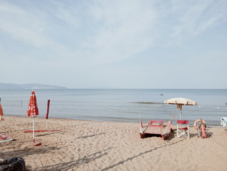 Beach chairs and umbrellas on the shore of the seaの写真素材