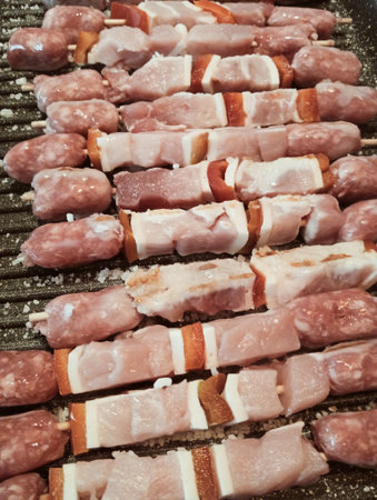 Skewers of pork on a barbecue grill. Selective focus. Toned.の写真素材