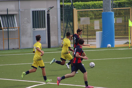 young soccer players during a youth championship match in Italyの写真素材