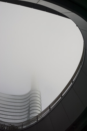 Skyscraper "Unicredit Tower" in the modern district of Milan "Porta Nuova" in a foggy dayのeditorial素材